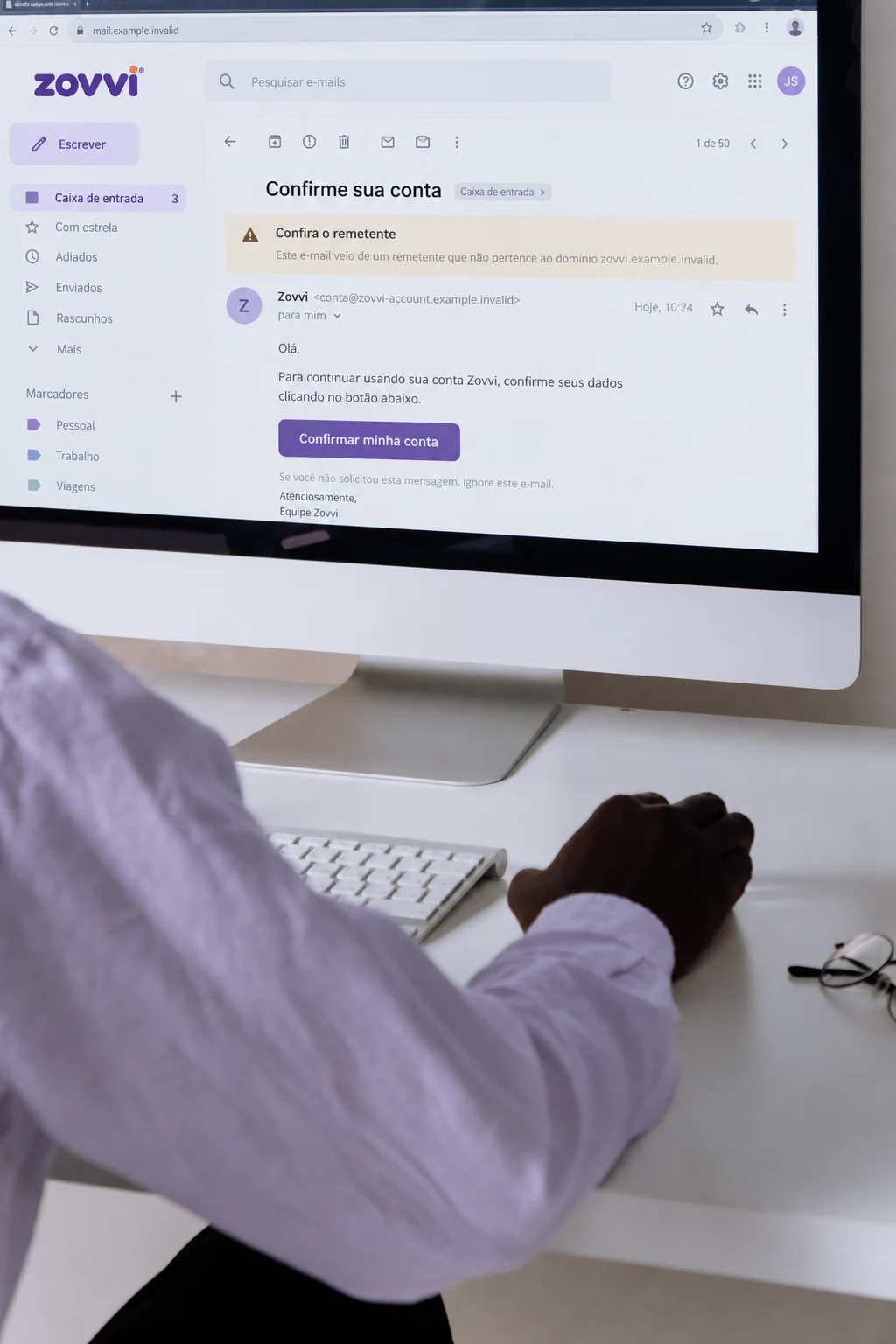 Person checking a message sender on a computer