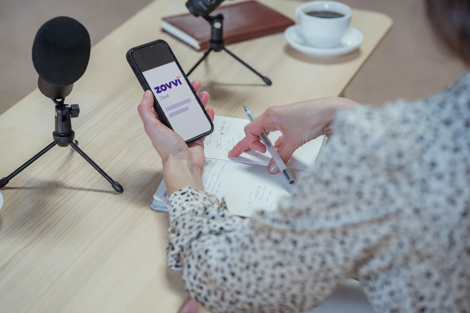 Content preparation with Zovvi on a phone, a notebook and microphones.