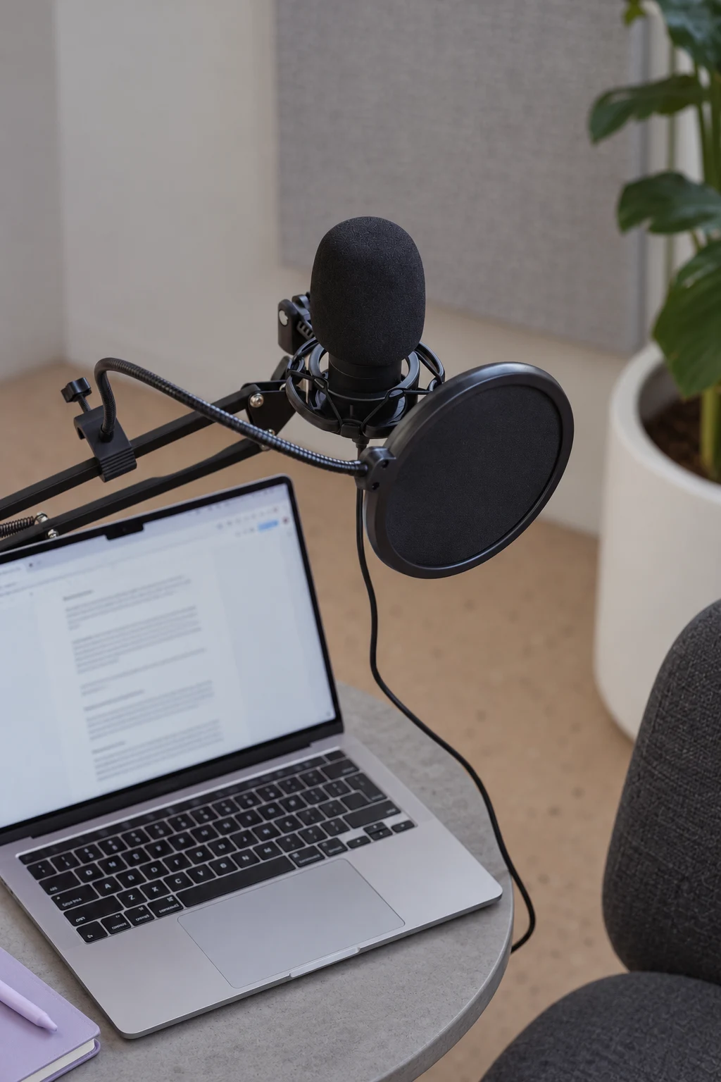 Microphone and MacBook ready for a conversation