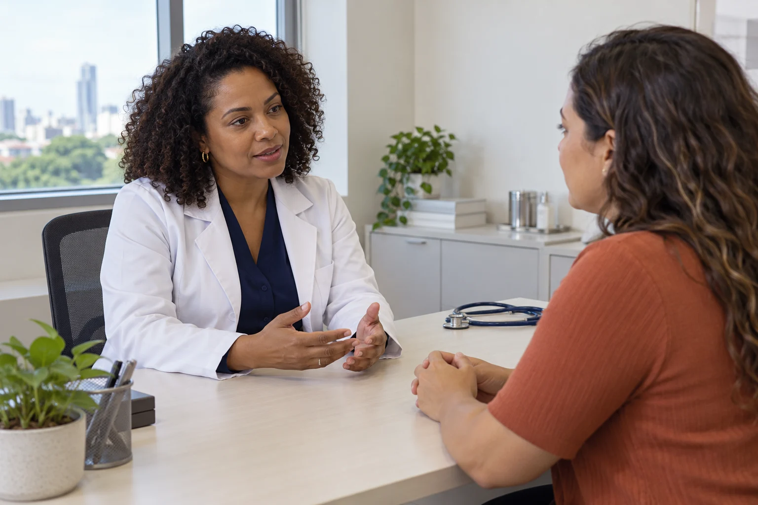 Doctor speaking with a visitor in a contemporary medical office in Brazil
